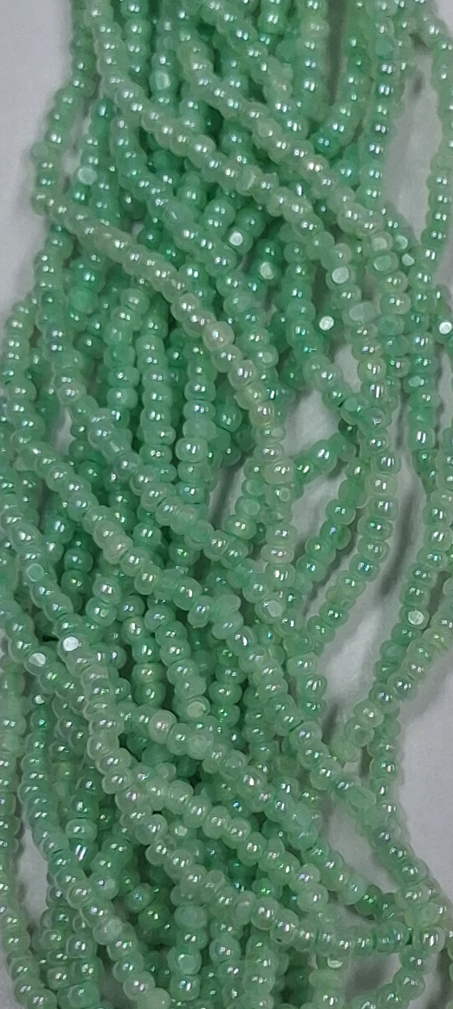 Size 13/0 Charlotte cut seed beads  Green Ceylon OP full hank