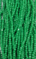 Size 13/0 Charlotte cut seed beads . Green OP full hank