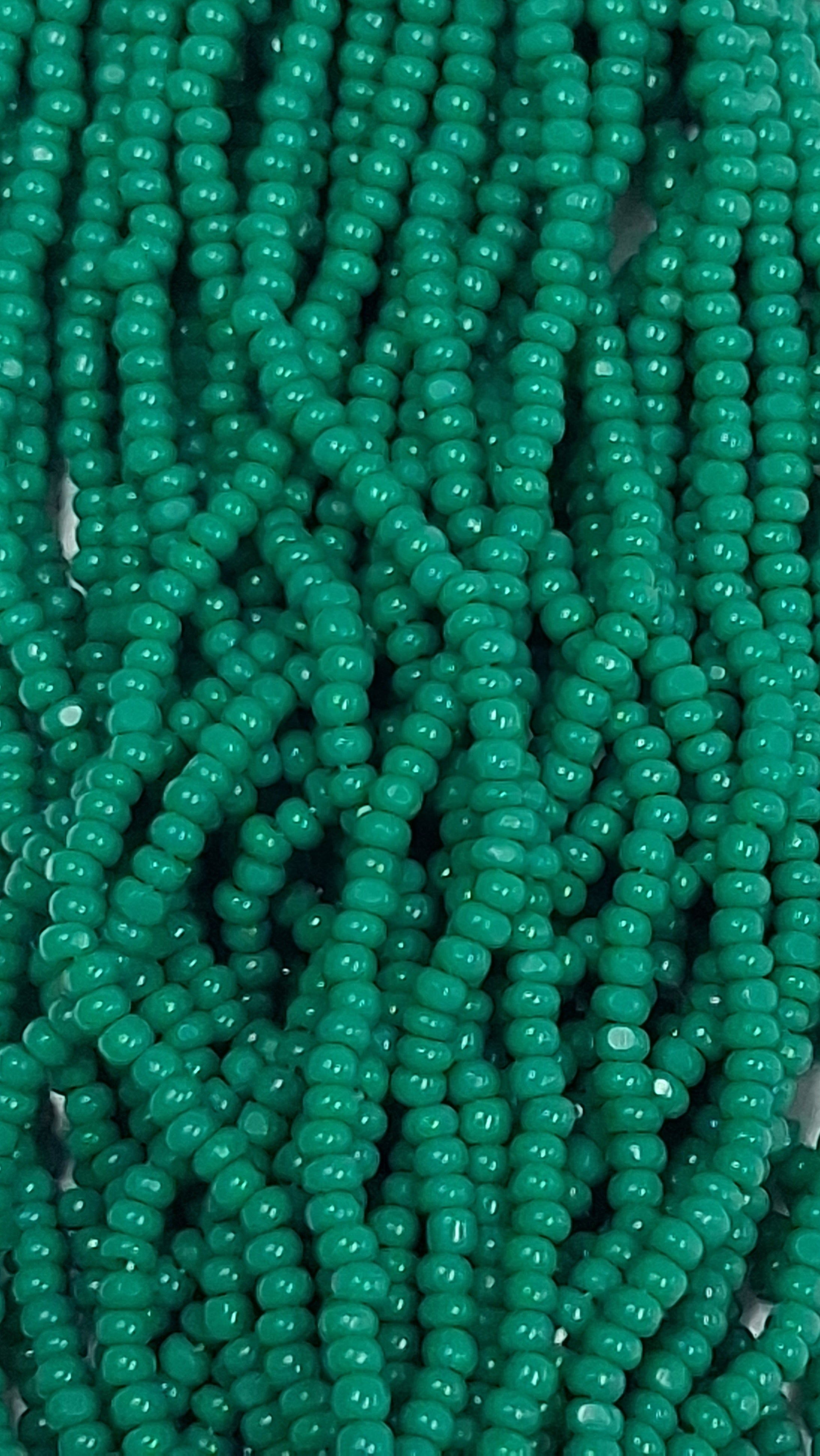 Size 13/0 Charlotte cut seed beads . Jade Green OP full hank