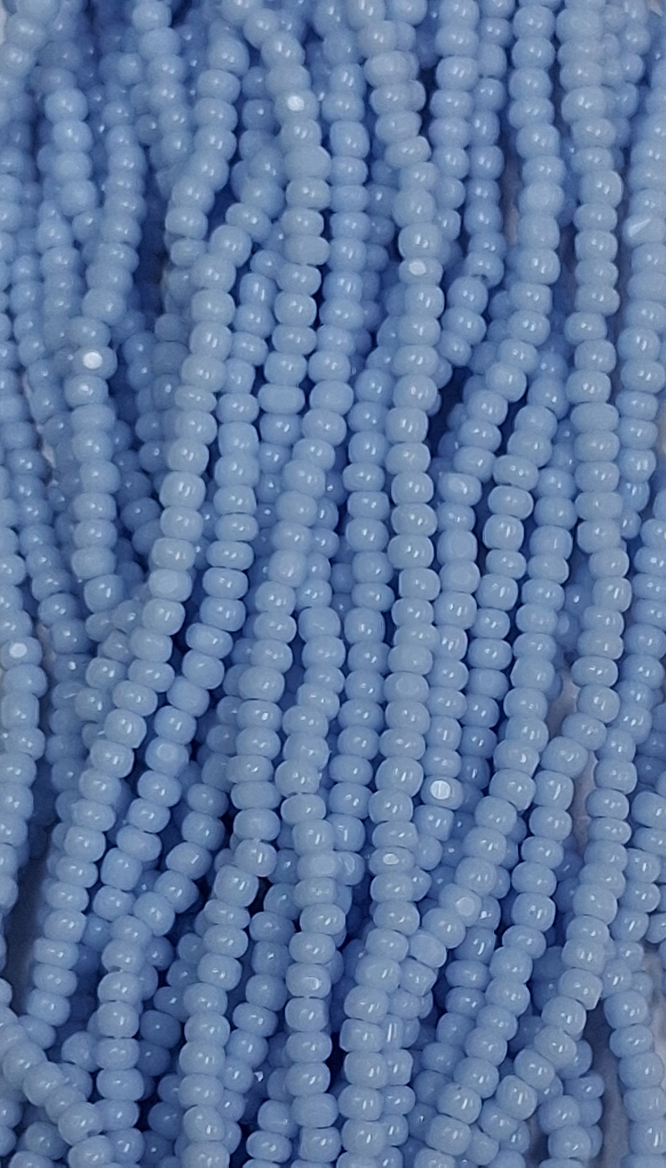 Size 13/0 Charlotte cut seed beads . Powder Blue OP full hank