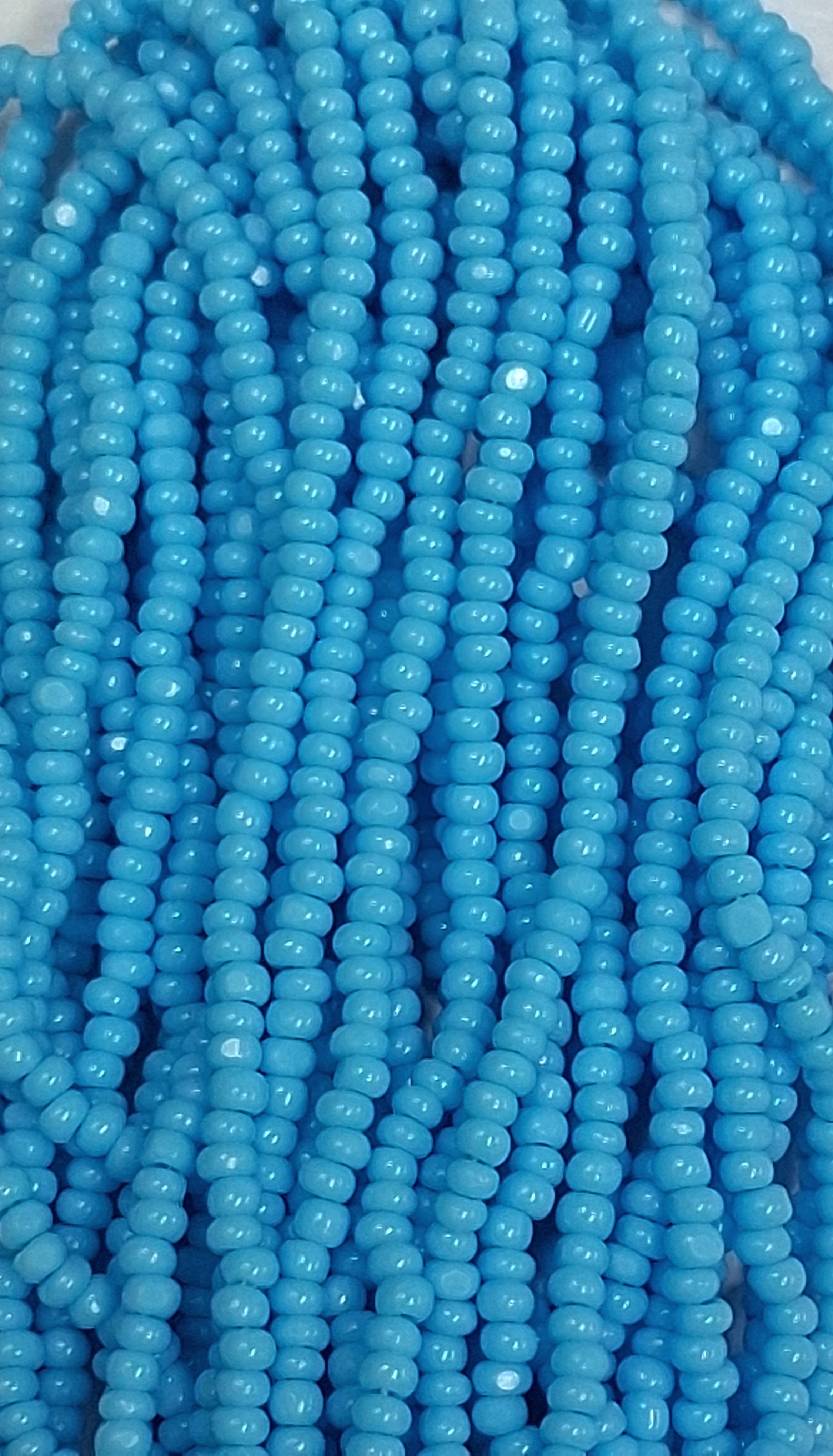 Size 13/0 Charlotte cut seed beads .  Lt. Blue OP full hank