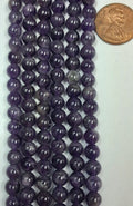 Amethyst 6 mm round  beads   7.5 inch strand
