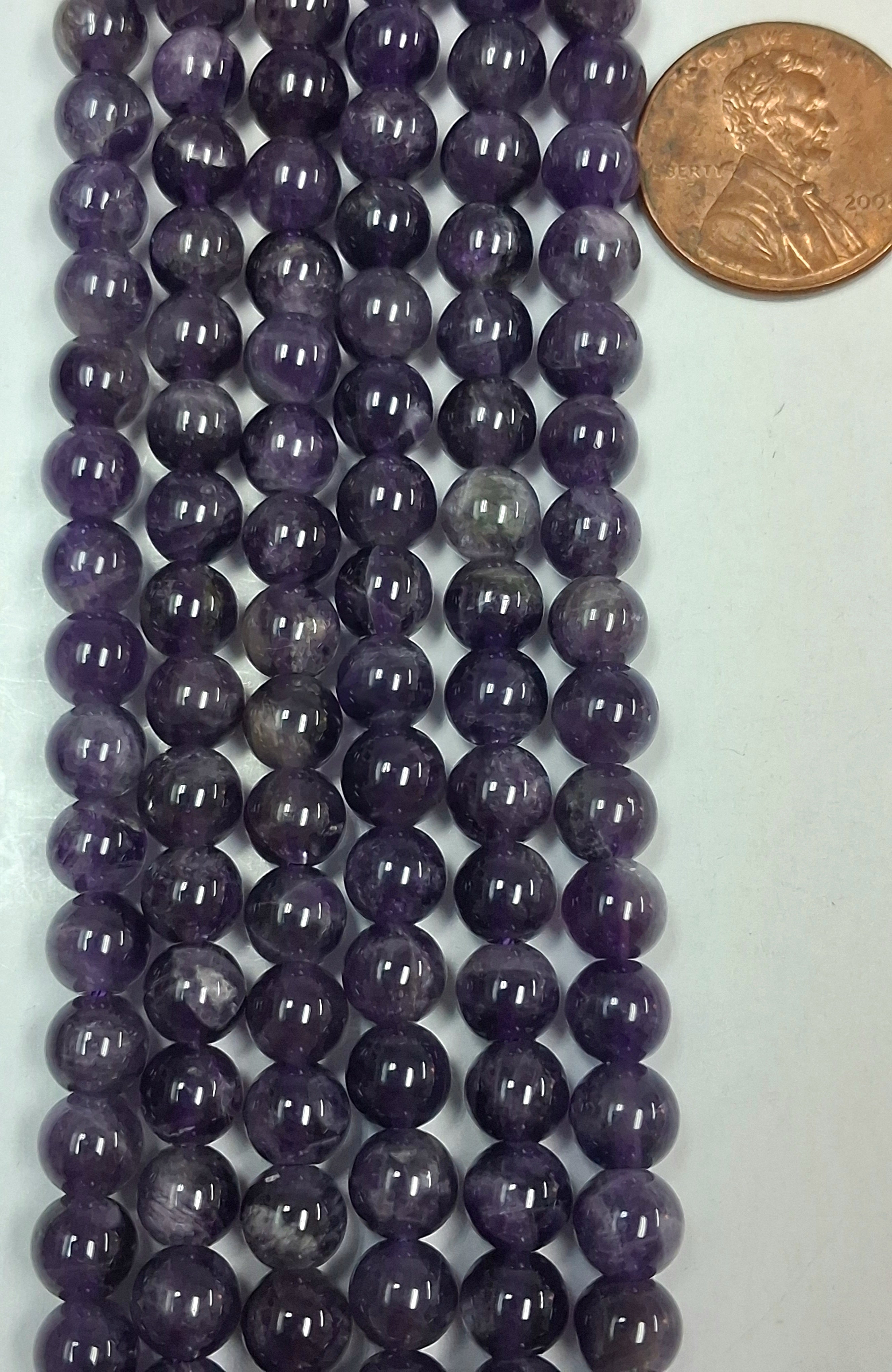 Amethyst 6 mm round  beads   7.5 inch strand