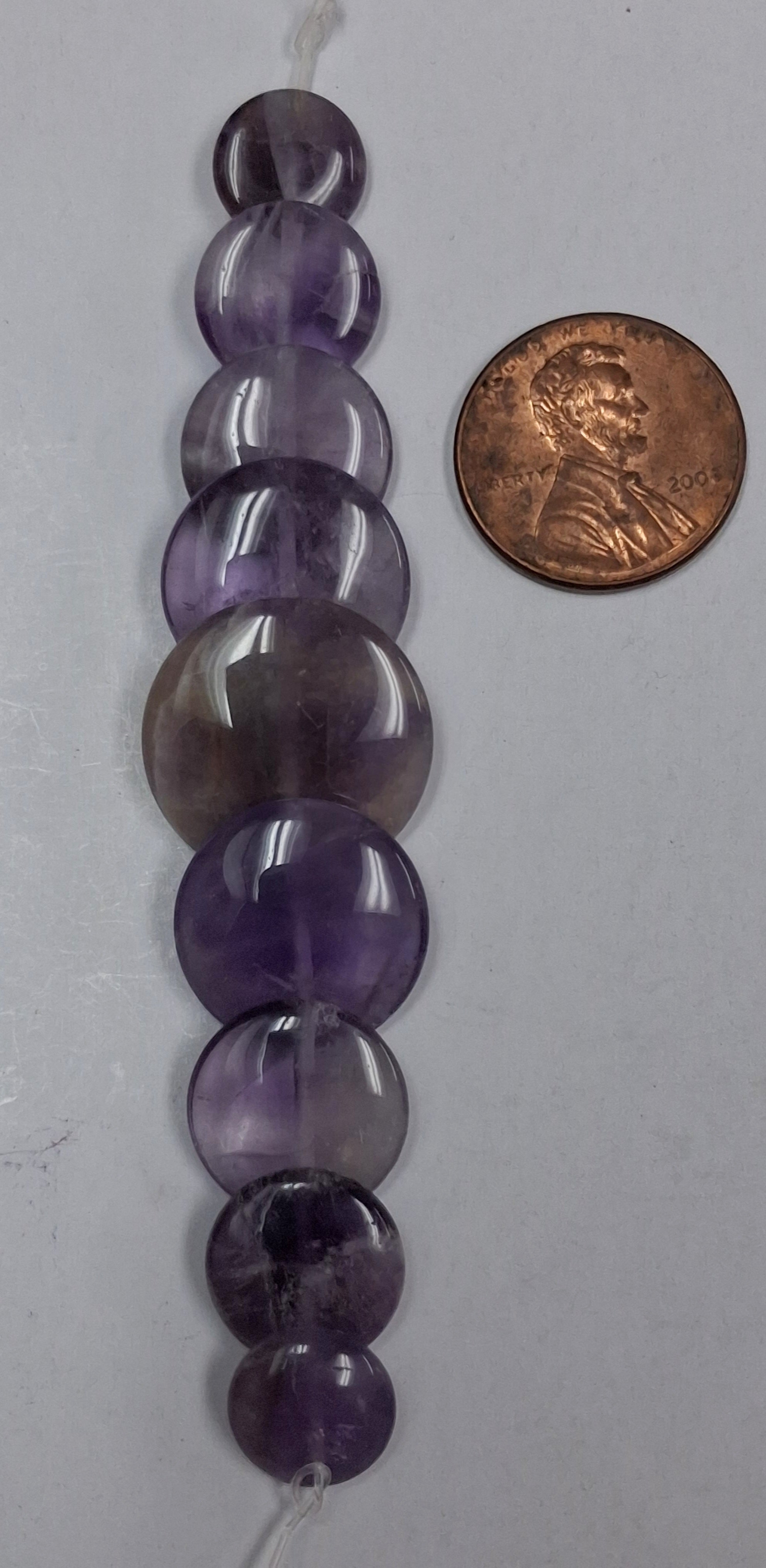 Amethyst Graduated overlapping Coins 9 pcs.