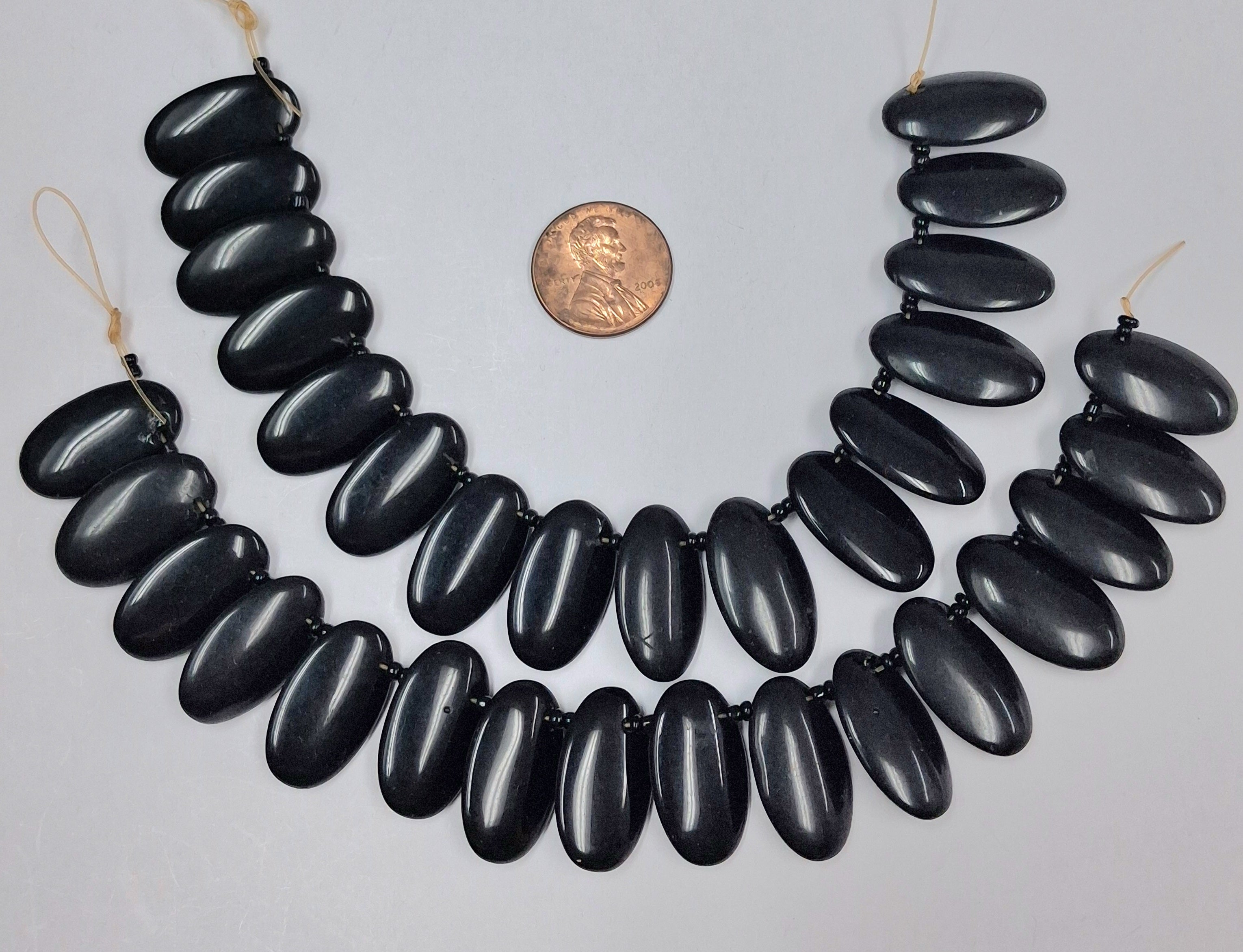 Black Onyx Overlapping Oval 12x21 mm 7 inch strand