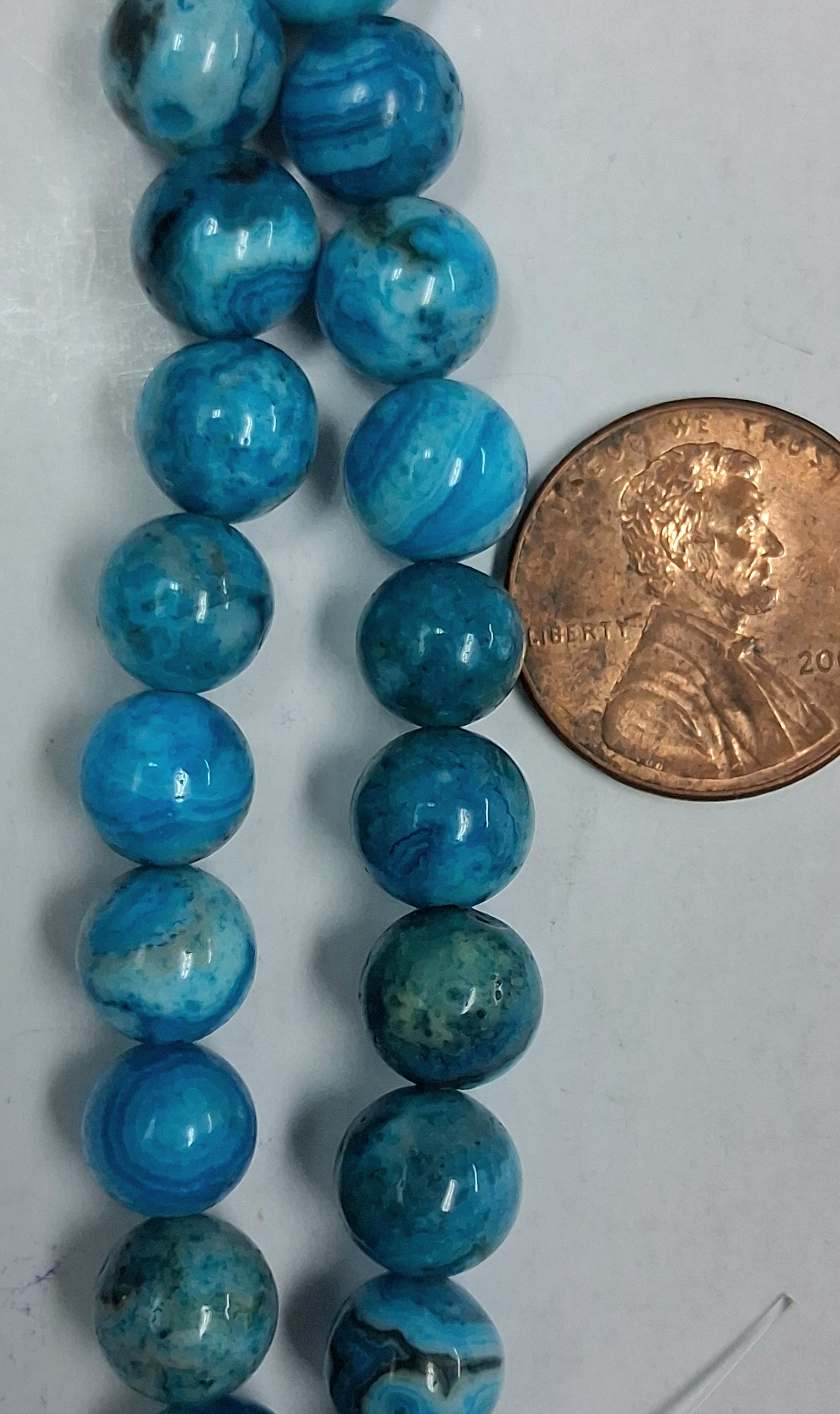 Larimar Crazy Lace Agate   8 mm round beads   8 inch strands