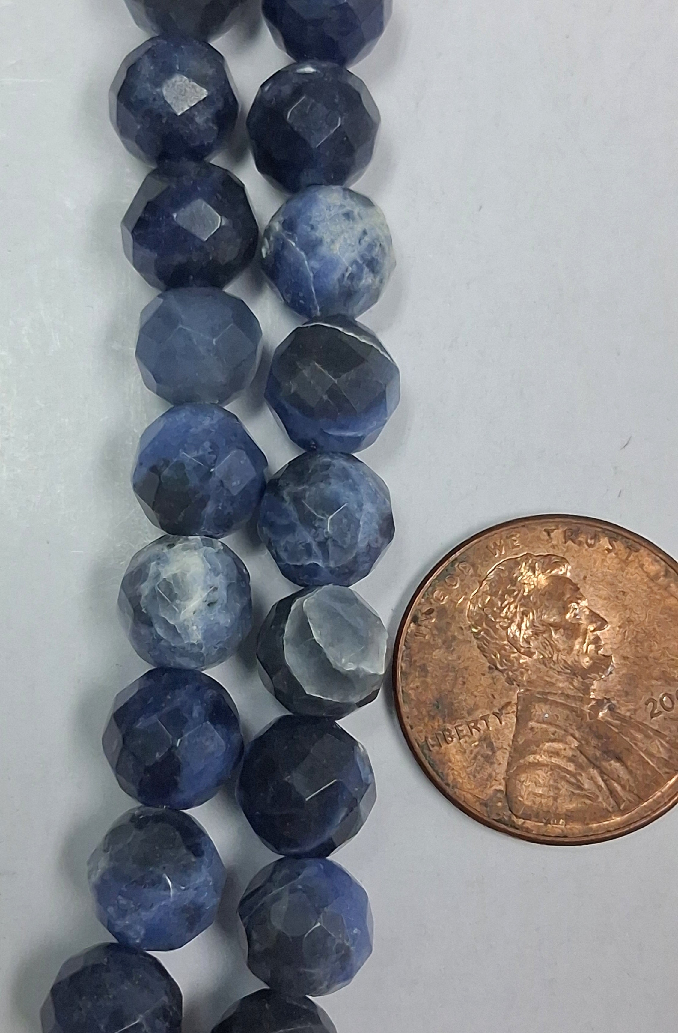 Sodalite  Faceted 8 mm round beads   8  inch strand