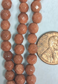 Goldstone Faceted 6 mm round beads   7.5 inch strand