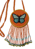 3 1/4" Beaded Butterfly Medallion Necklace w/ 29" beaded chain and 2 1/2" fringe. Leather backing. Orange