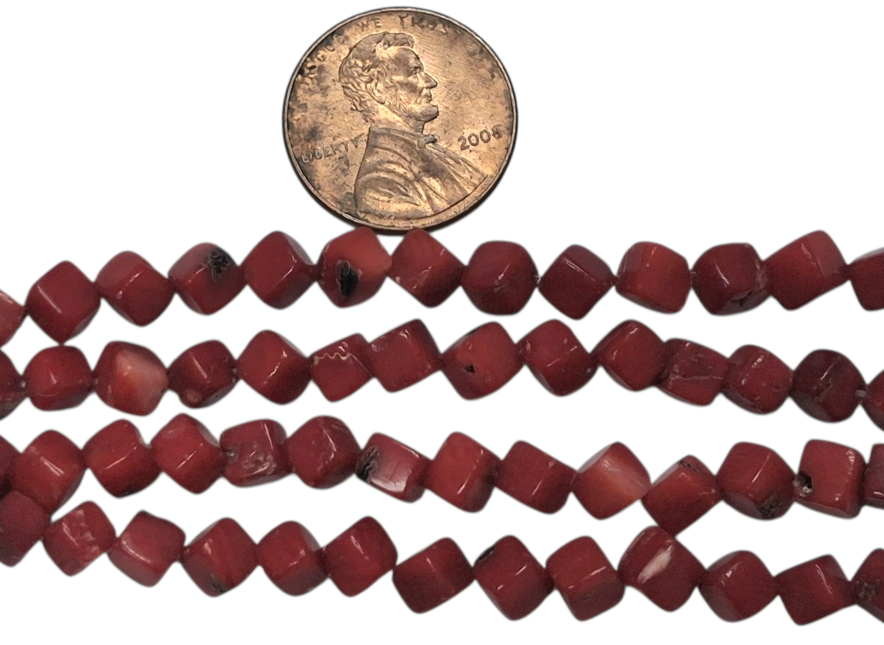 6mm Red Coral Diagonal Cube beads 8 inch strand