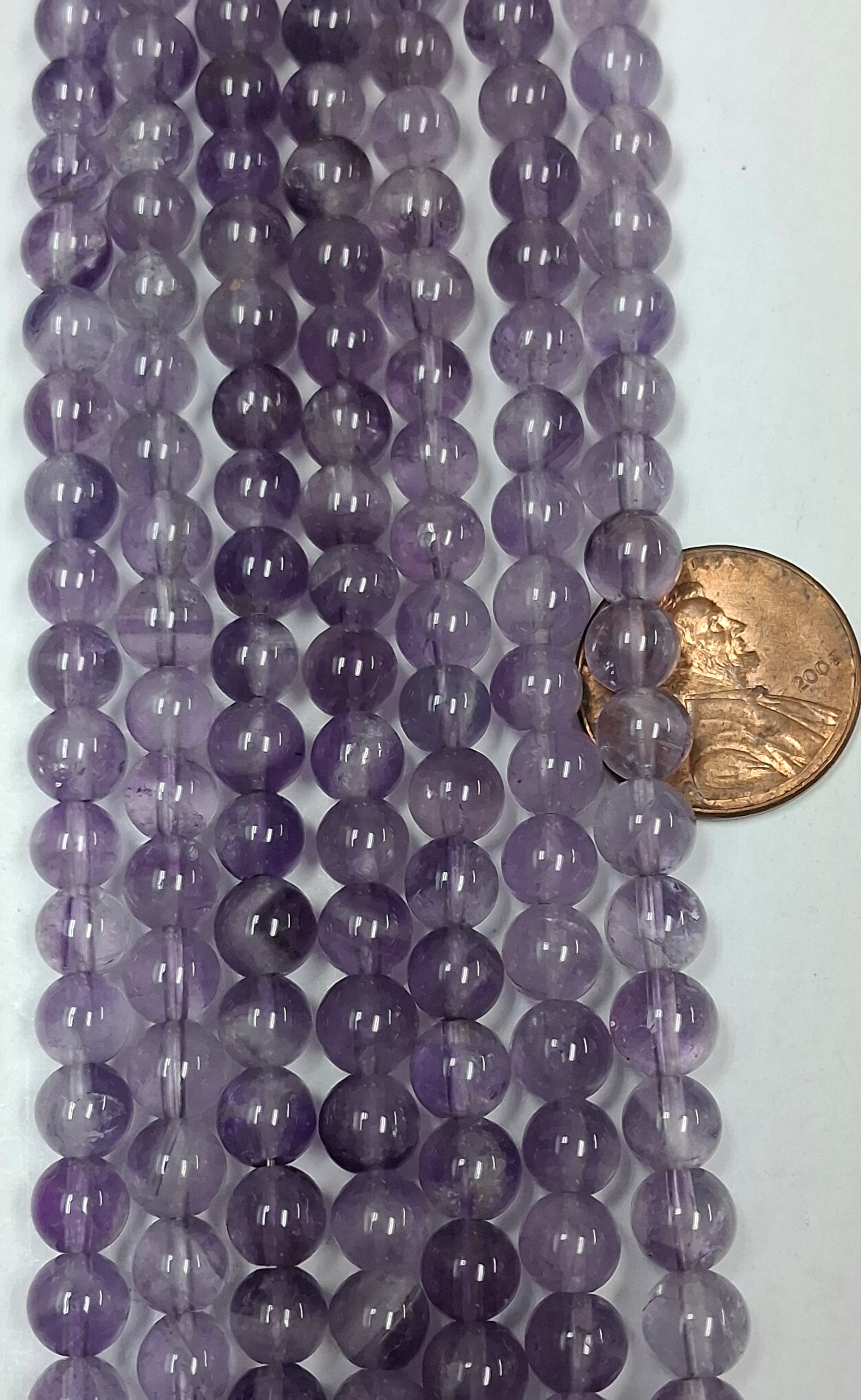 Light Amethys6 mm round  beads   8 inch strand