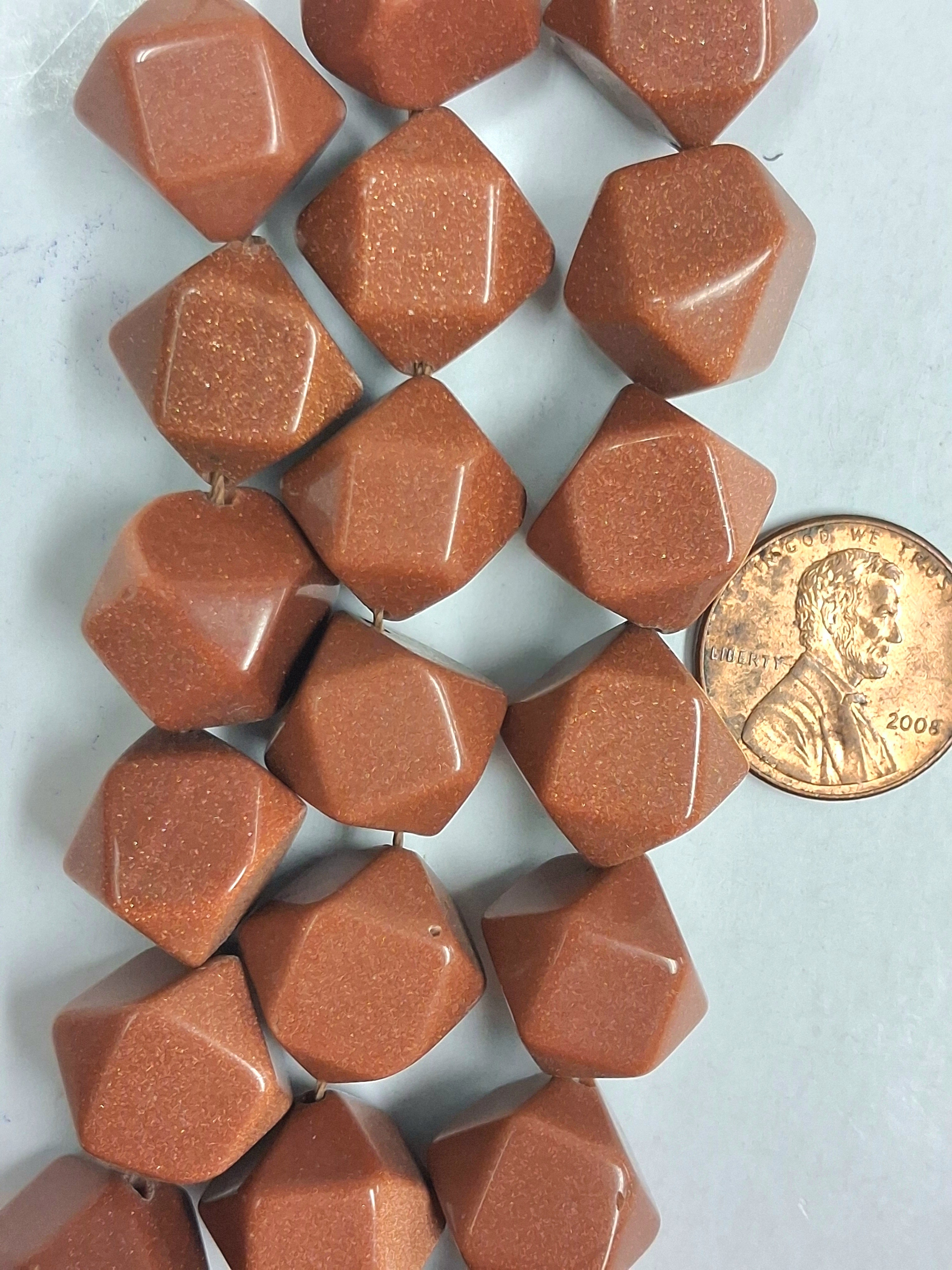Goldstone Faceted 12x12 mm nuggets  8 inch strand