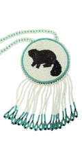 3" Beaded Beaver Medallion Necklace w/ 28.5" beaded chain and 2.5" fringe. Leather backing. White, turquoise