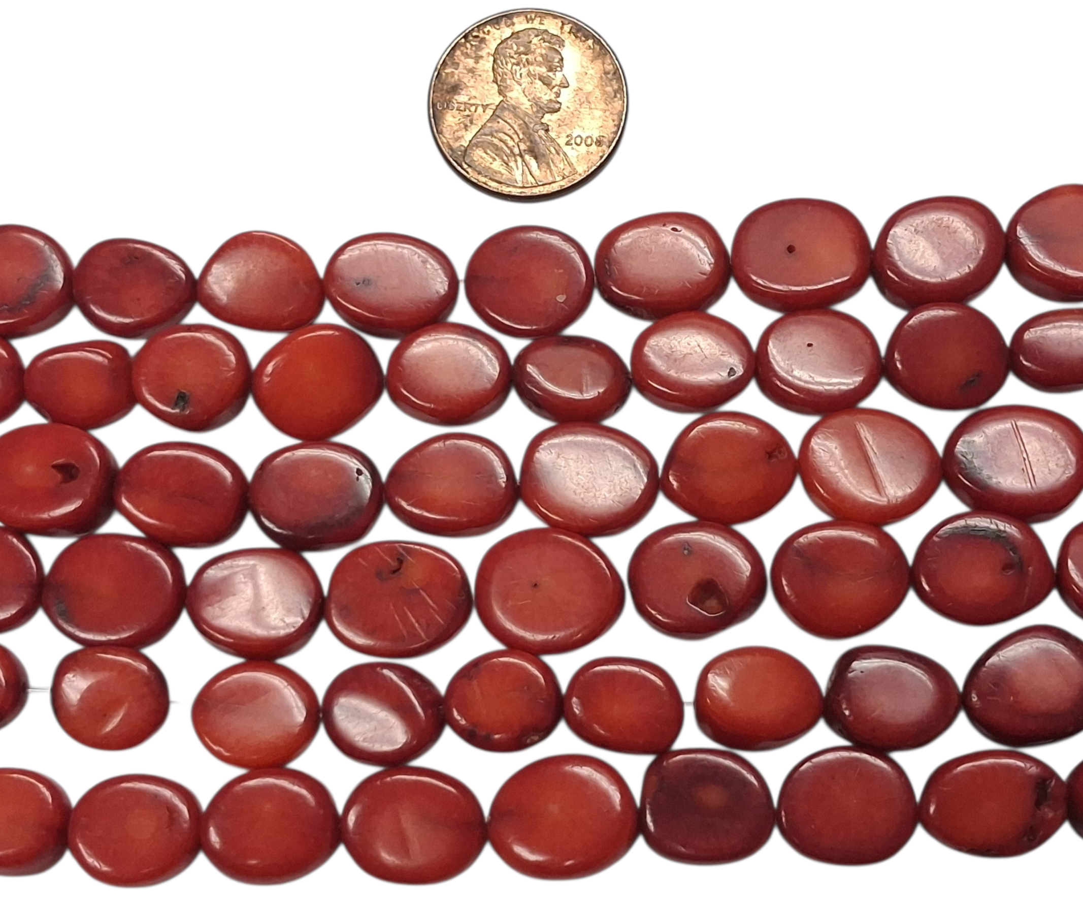 Red Coral Oval 8-12 mm beads 8 inch strands
