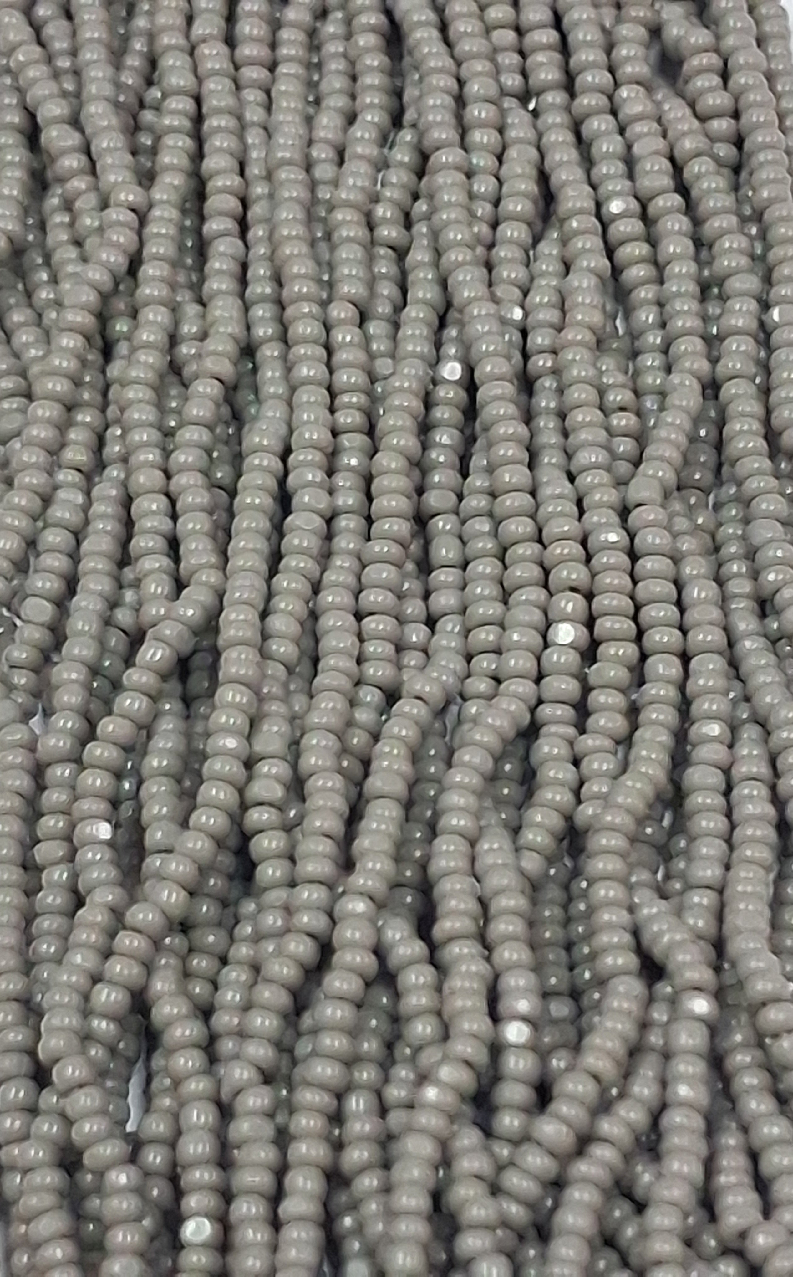 Size 13/0 Charlotte cut seed beads Gray  OP full Hank
