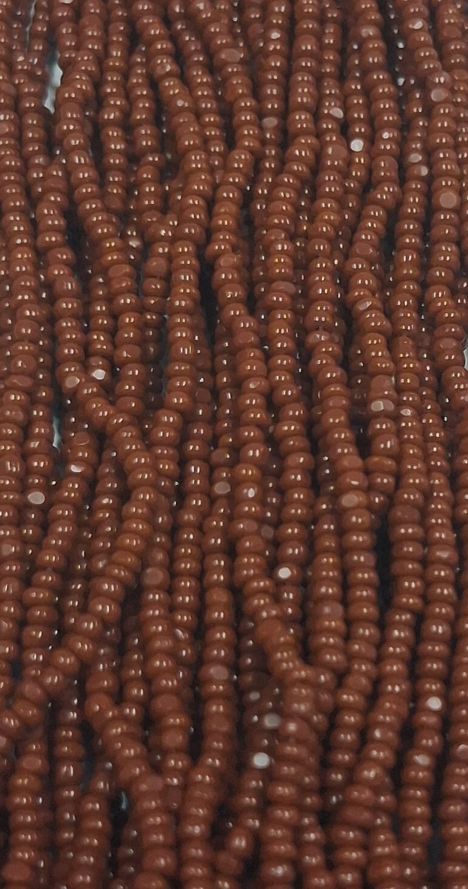 Size 13/0 Charlotte cut seed beads Brown op full hank