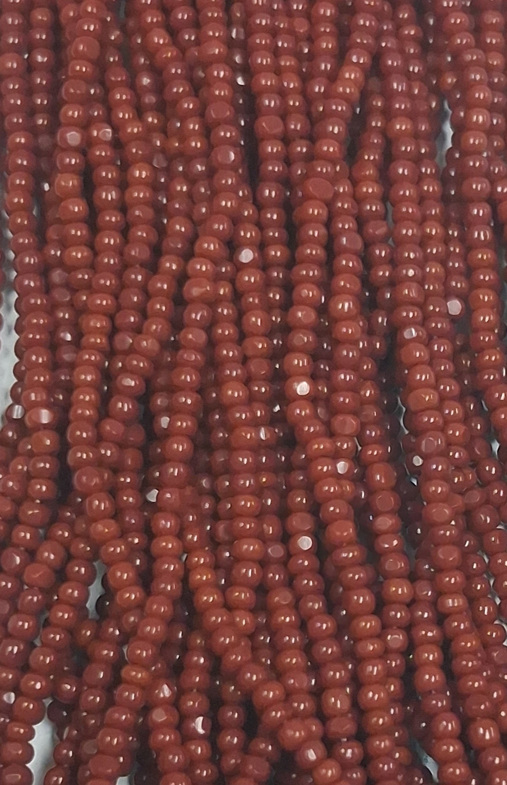 Size 13/0 Charlotte cut seed beads Lt Brown op full hank