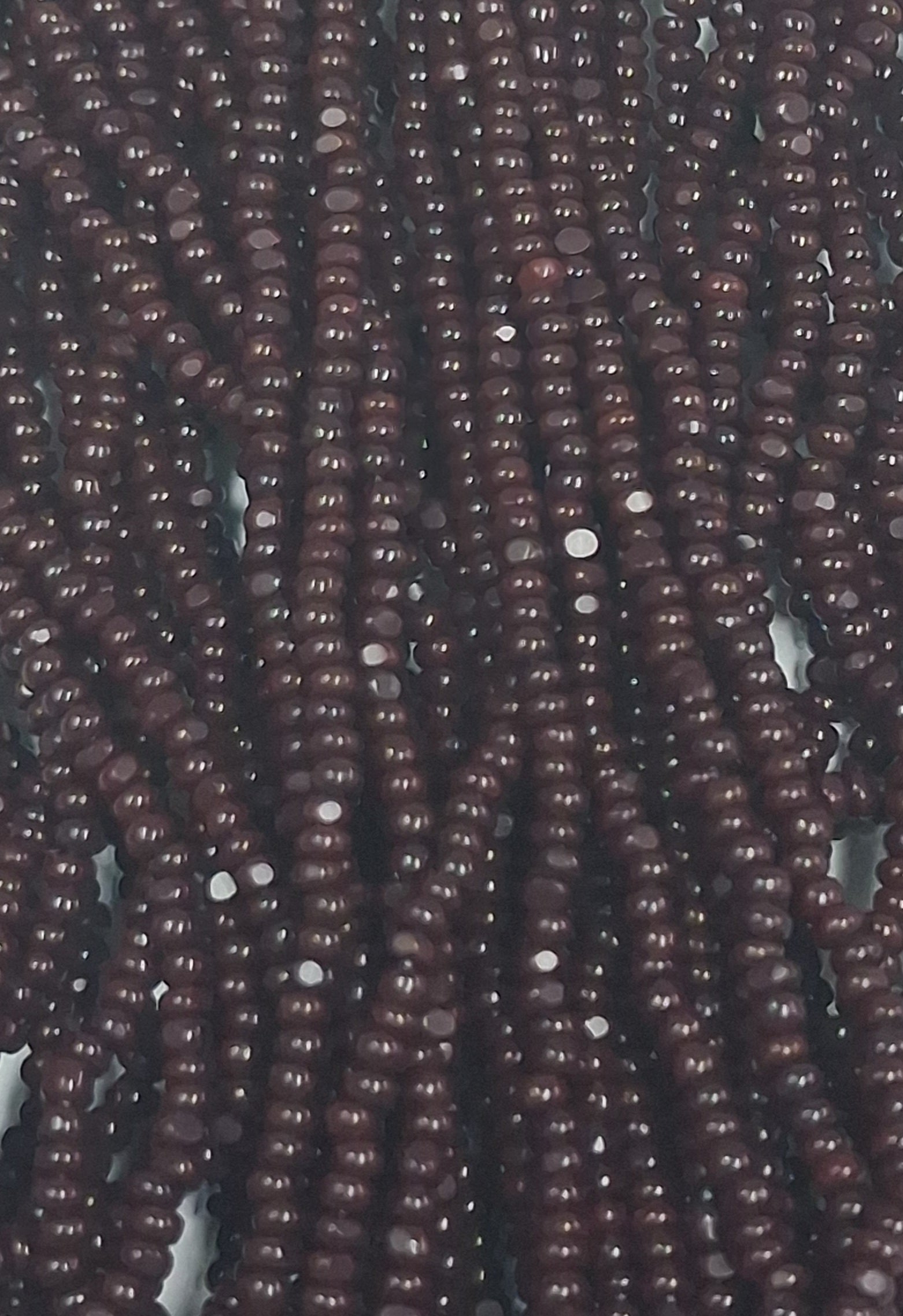 Size 13/0 Charlotte cut seed beads Dark Brown op full hank