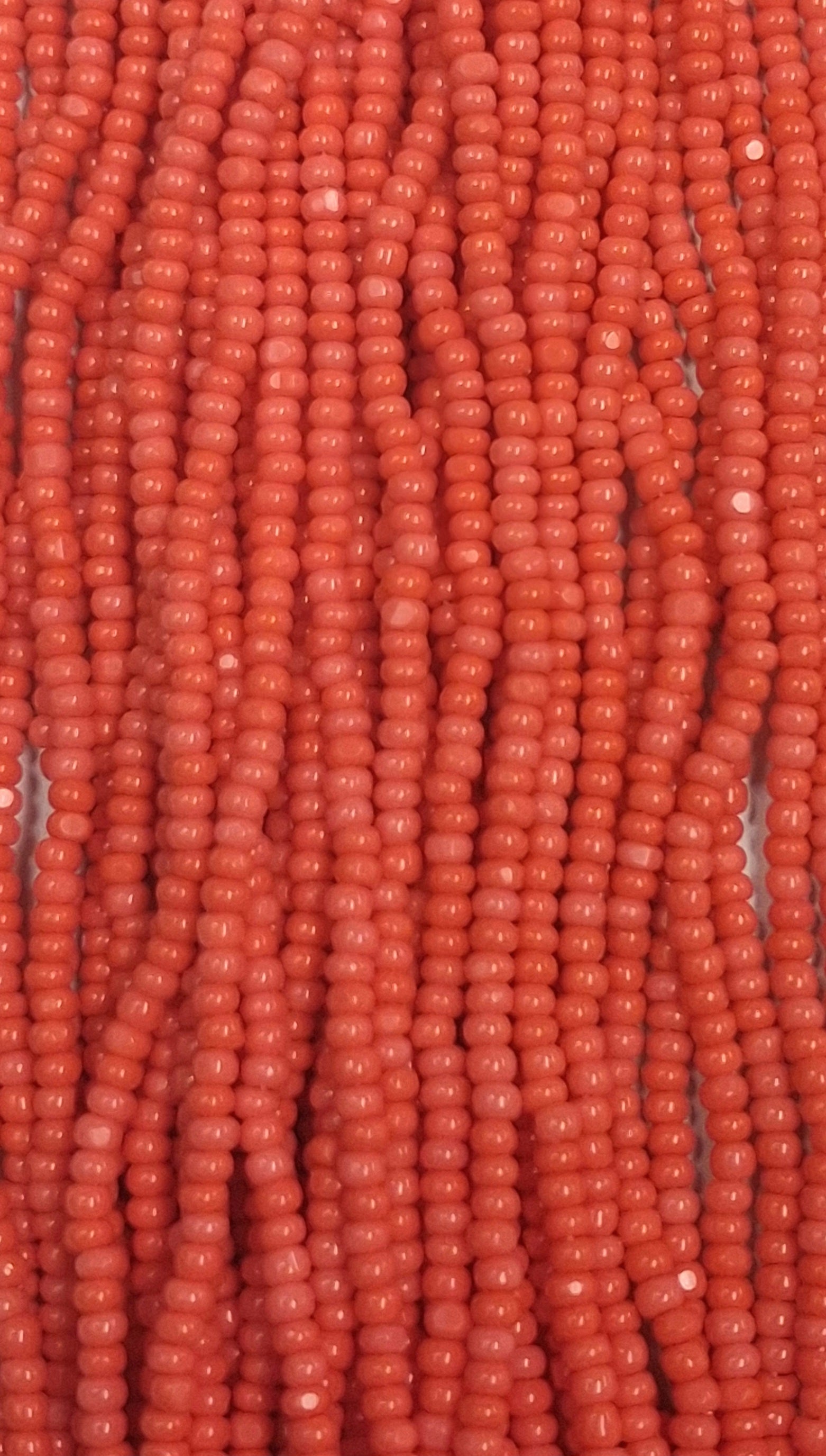 Size 13/0 Charlotte cut seed beads Coral op full hank