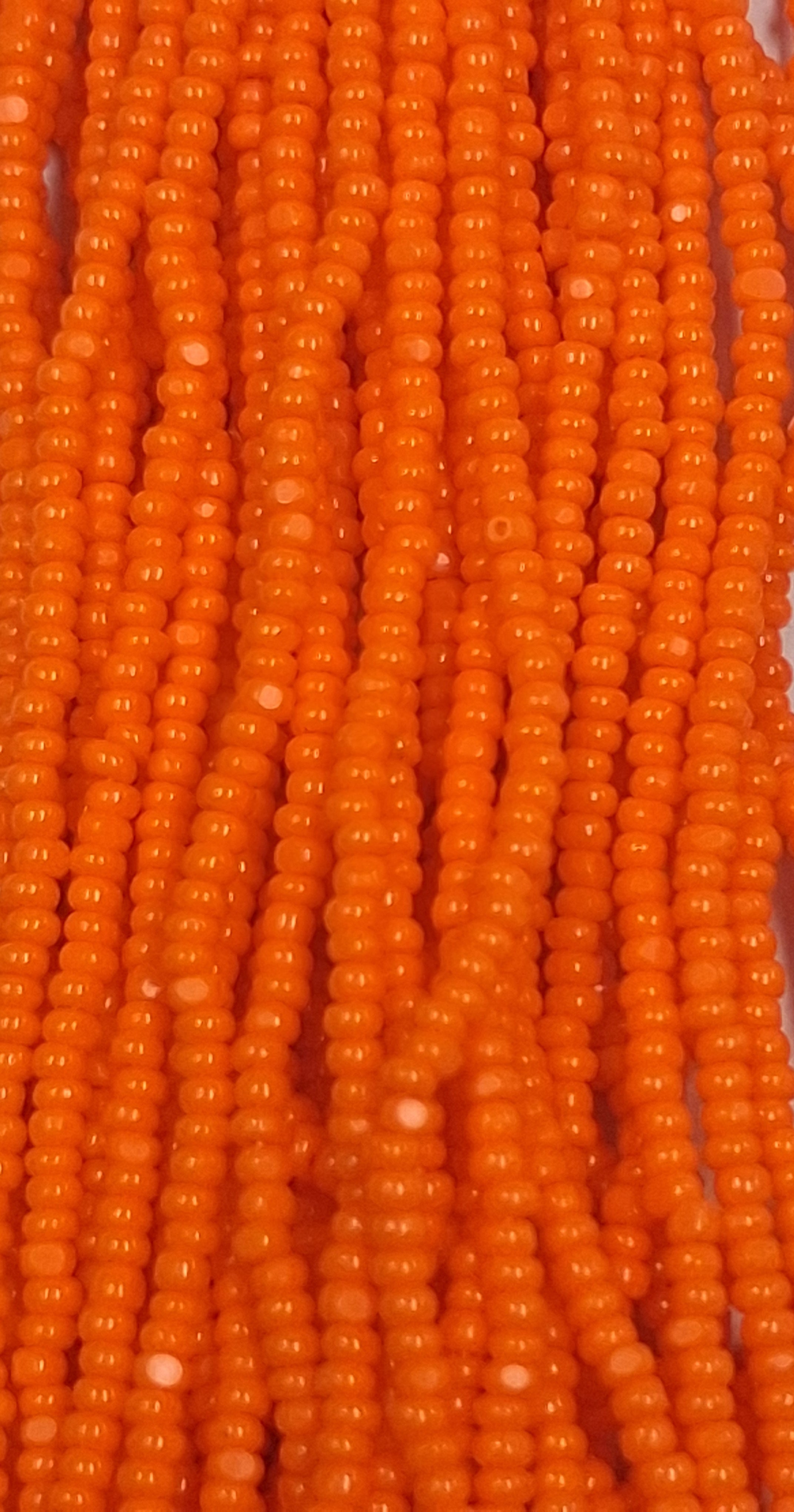 Size 13/0 Charlotte cut seed beads Orange op full hank