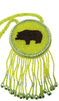 3 1/4"  Beaded Bear Medallion Necklace w/ 28" beaded chain and 2 1/2" fringe. Leather backing. Green