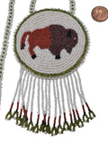 3 1/4" Beaded Buffalo Medallion Necklace w/ 28" beaded chain and  2" fringe. Leather backing. White-green