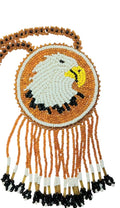 2 3/4" Beaded Eagle Medallion Necklace w/ 29" beaded chain and 2.5" fringe. Leather backing. Orange