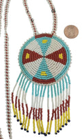 2 1/2" Beaded Geometric Medallion Necklace w/ 27" beaded chain and 2" fringe. Leather backing. Turq-red-yellow